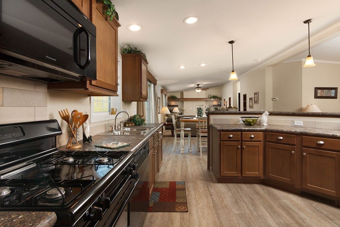 The TRUMAN 5628-68 Kitchen. This Manufactured Mobile Home features 3 bedrooms and 2 baths.