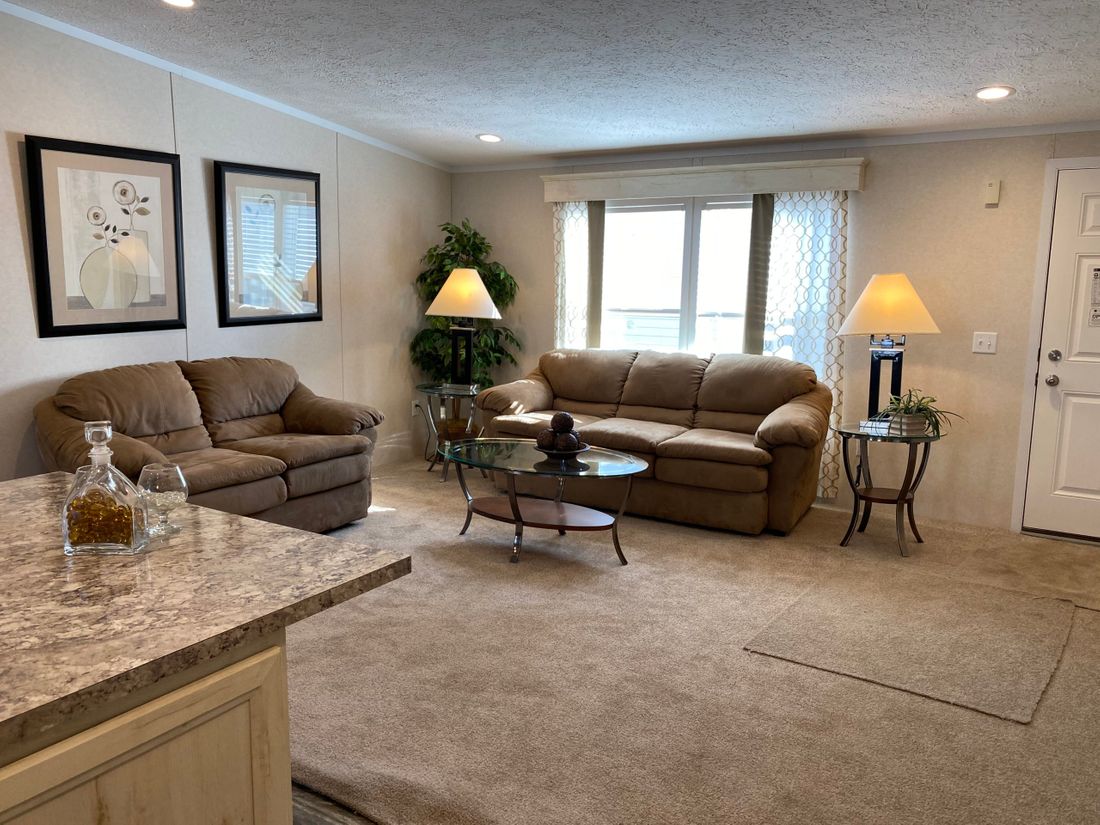 The TUSCARORA 4828-1860 Living Room. This Manufactured Mobile Home features 3 bedrooms and 2 baths.