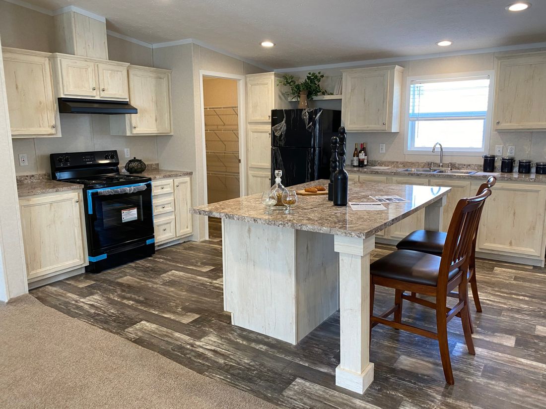 The TUSCARORA 4828-1860 Kitchen. This Manufactured Mobile Home features 3 bedrooms and 2 baths.