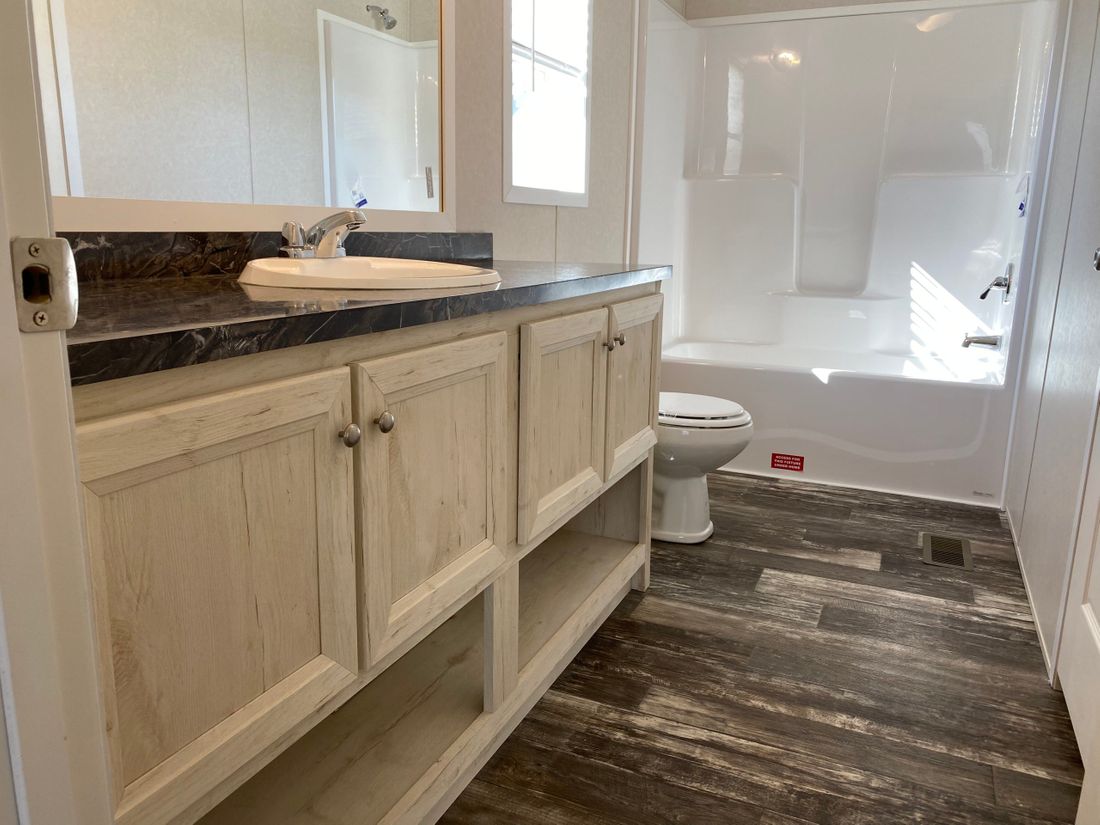 The TUSCARORA 4828-1860 Master Bathroom. This Manufactured Mobile Home features 3 bedrooms and 2 baths.