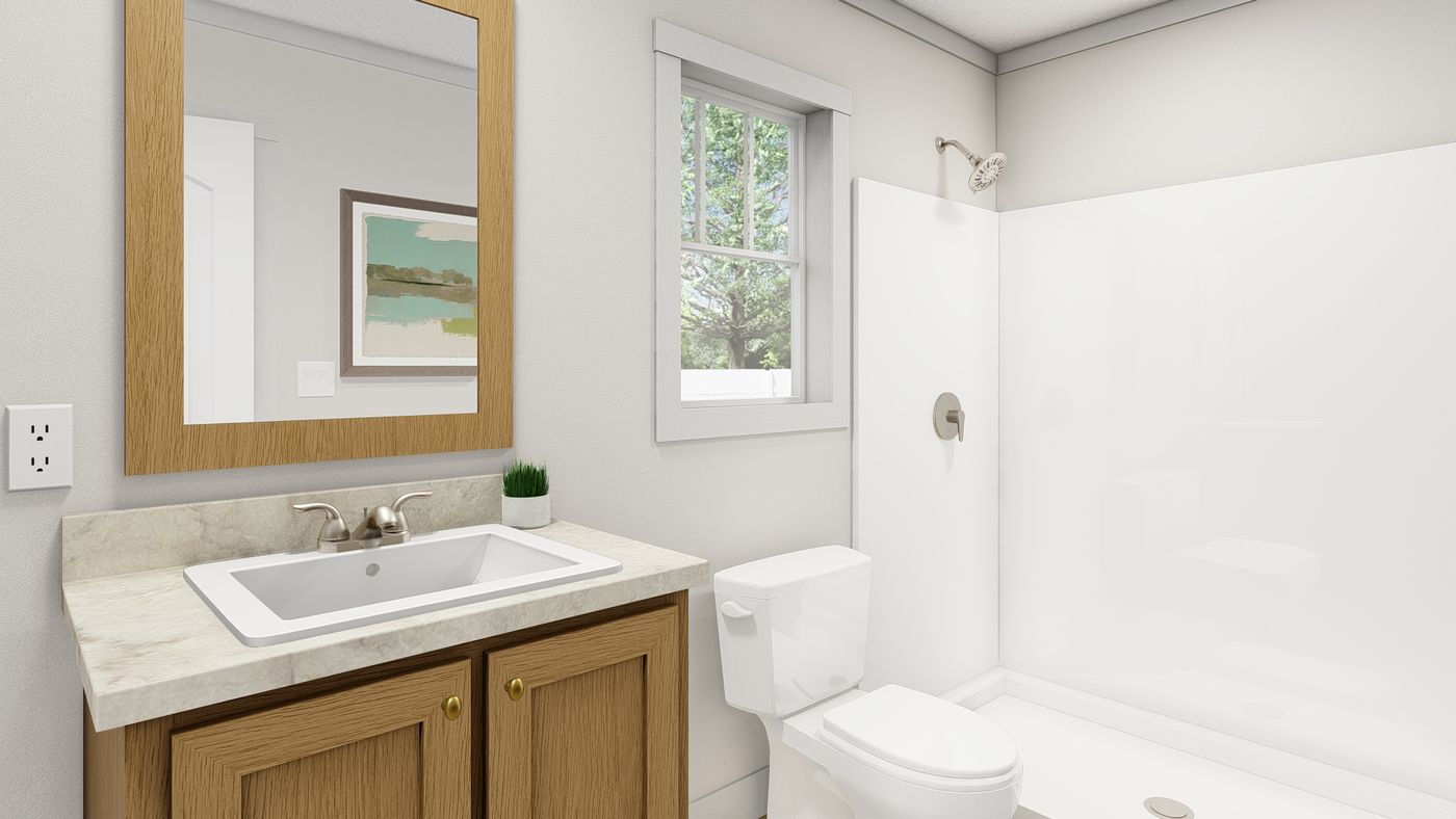 The 1003 "BORN TO RUN" 6016 Guest Bathroom. This Manufactured Mobile Home features 2 bedrooms and 2 baths.