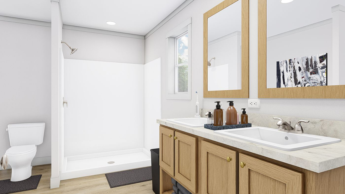 The STAYIN' ALIVE Primary Bathroom. This Manufactured Mobile Home features 3 bedrooms and 2 baths.